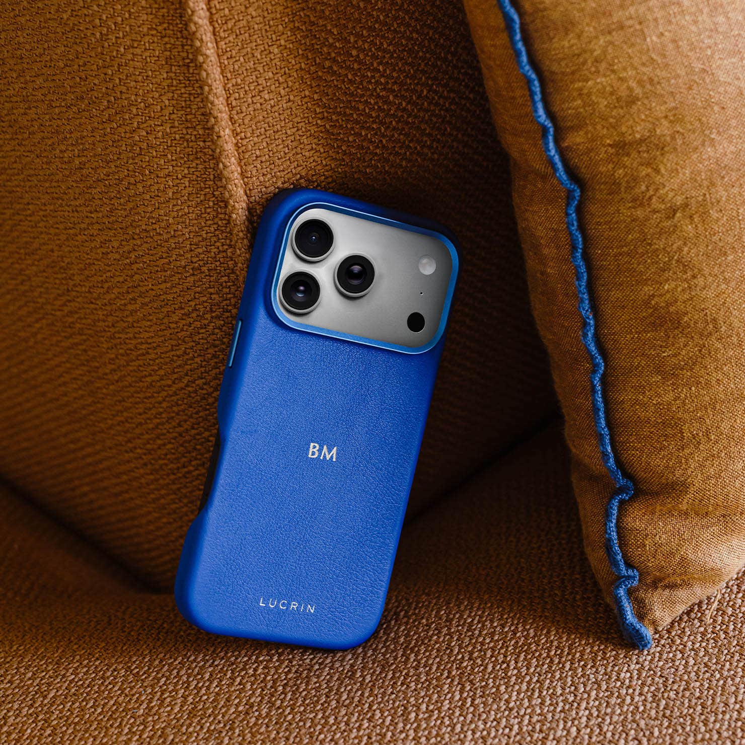 iPhone 17 Pro with blue luxury leather case and bumper